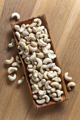 Cashews in old wooden dish