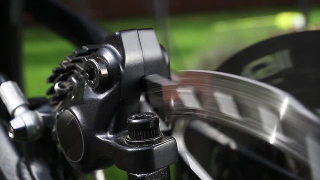 Bicycle disk brake rotor in focus close up
