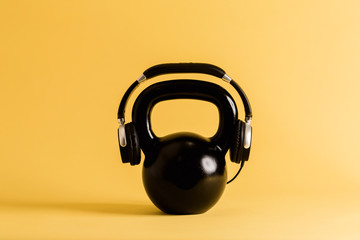 Naklejka premium Kettlebell with headphones