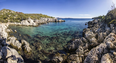 volcanic beach surrounded by mountains