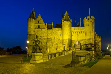 Foto op Canvas 'Het Steen' fortress with the Lange Wapper monument during blue hour, Tuesday 4 April 2017, Antwerp, Belgium. © Erik_AJV