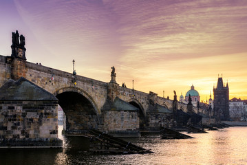 Fototapeta na wymiar Charles Bridge (Karluv Most) and Old Town Tower, the most beautiful bridge in Czechia. Prague, Czech Republic.