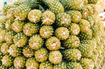 Fototapeta premium Fresh pineapples in supermarket