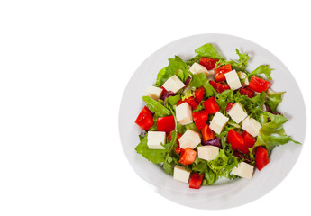 fresh vegetables salad with cheese. top view. isolated on white