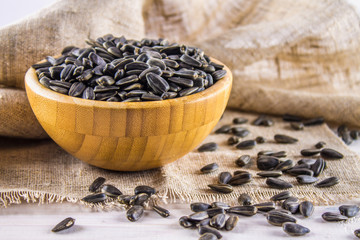 Fresh Sunflower seed. Shelled sunflower seeds in wood bowl.