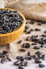 Fresh Sunflower seed. Shelled sunflower seeds in wood bowl.
