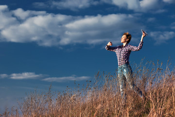 Fototapeta premium A girl with a paper airplane 