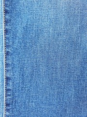 Closeup blue denim/jeans with seam background.