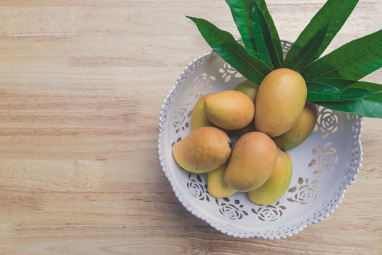 Mango on a wood background