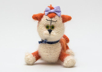 The cat knitted stuffed toy