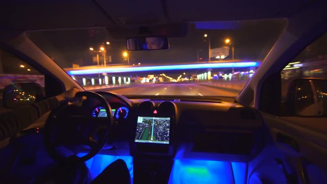 The man drive a car on the city highway. evening night time. wide angle, real time capture
