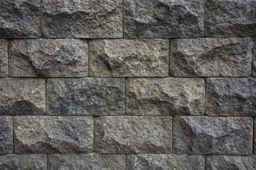 Facing a decorative brick of a dark color.