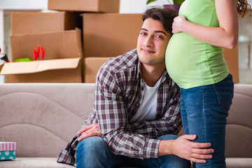Young couple of man and pregnant wife expecting baby