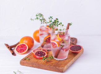Orange lemonade with thyme, cinnamon, ice and honey
