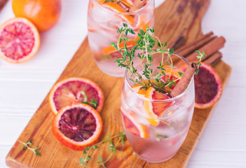 Orange lemonade with thyme, cinnamon, ice and honey