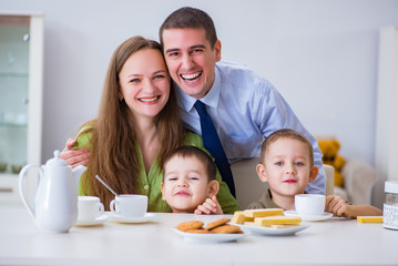 Happy family having breakfast together at home