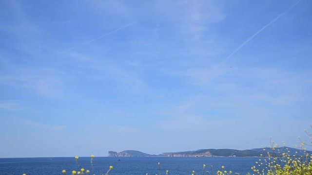 Airplane flying over Alghero coast, Sardinia