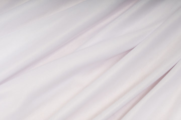 Fototapeta na wymiar White cloth with pink shade in the folds