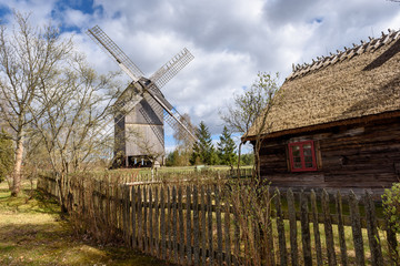 Old wooden windmill in Kashubian Ethnographic Park in Wdzydze Kiszewskie. Poland. - obrazy, fototapety, plakaty