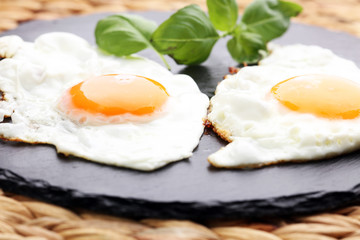 fried eggs with basil pepper and salt