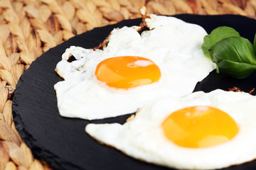 fried eggs with basil pepper and salt