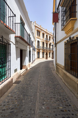 Ronda (Andalucia, Spain): old typical street with white houses