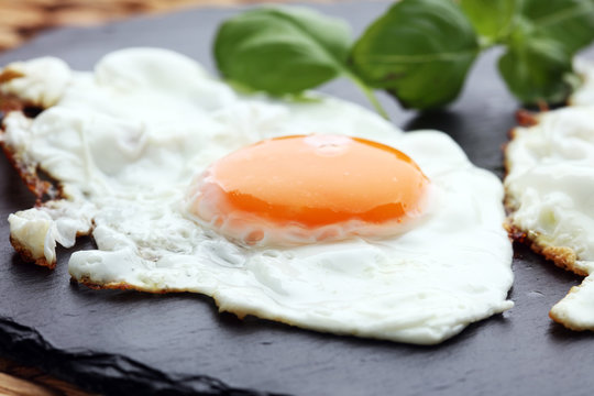 fried eggs with basil pepper and salt