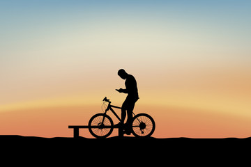 Obraz na płótnie Canvas cyclist holding phone