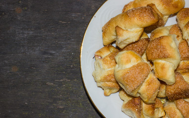 croissants in white plate on wooden table