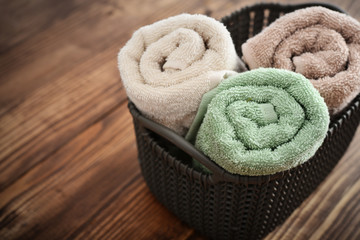 Fototapeta na wymiar Bath towels in wicker basket