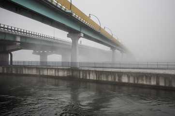 bridge over Vistula river in Krakow in heavy fog.