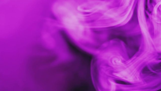 real violet smoke on balck background - ideal for transition or background