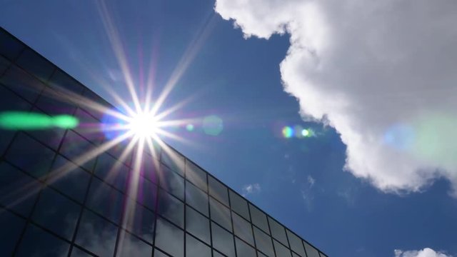 Sun and Clouds Reflected in Office Building Timelapse