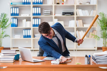 Angry aggressive businessman in the office