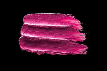 Smudged lipstick pink on a black isolated background