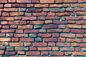 Aged red brick wall background. Retro toned.