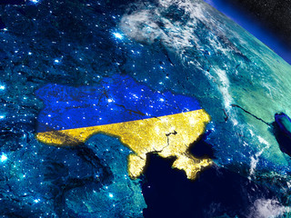 Ukraine with embedded flag from space © harvepino