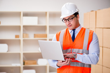 Man working in postal parcel delivery service office