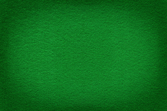 Green felt surface with light copy space in center