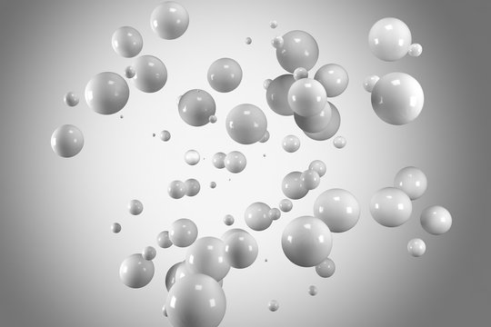 Group of abstract flying spheres on bright grey vigneting background © Andrey Kudrin