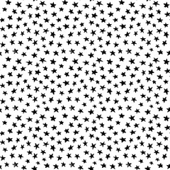 Sprinkles little stars pattern. Vector seamless wallpaper with hand drawn black stars on the white background. Pattern may be used for wallpaper, textile and wrapping paper. Hipster style sketch.