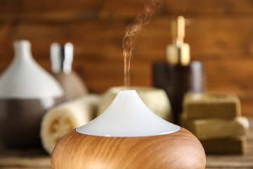 Oil diffuser on blurred background