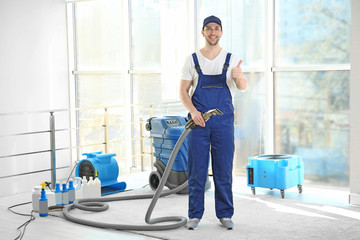 Fototapeta na wymiar Dry cleaner's employee working in flat