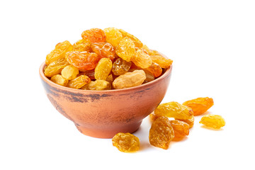 Ceramic bowl with golden raisins on white