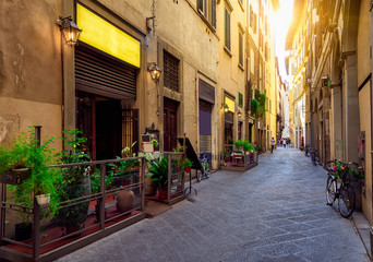 Fototapeta na wymiar Narrow cozy street in Florence, Tuscany. Italy