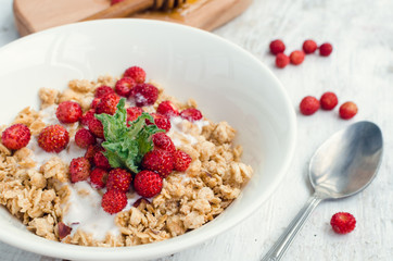 Granola with yoghurt and wild strawberries