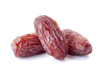 Three dried date-fruit on white