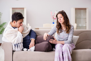 Obraz premium Wife caring for sick husband at home