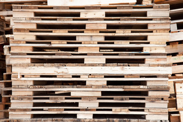 Stacked wooden pallets in  buy garbage shop for recycle