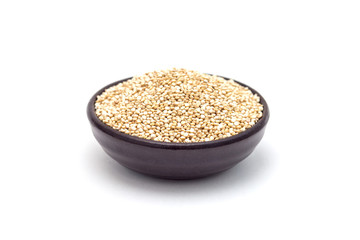 Ceramic bowl with healthy quinoa seeds isolated on white